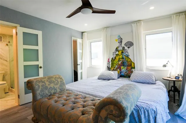 a white toilet sitting next to a bathroom sink