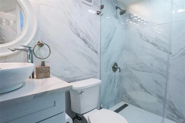 a view of a bathroom from a hallway