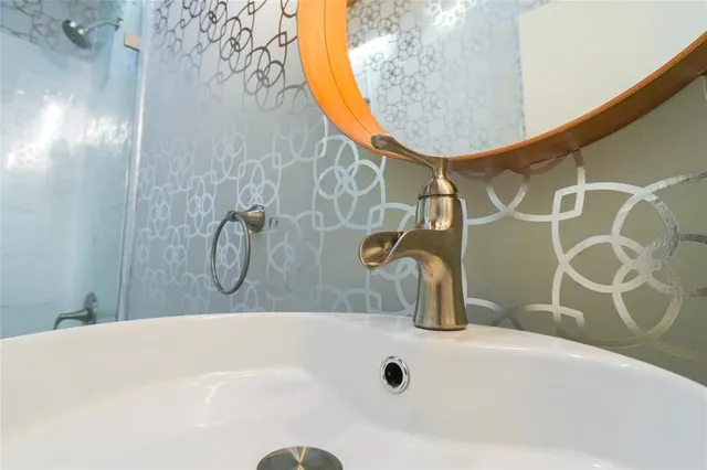 a bathroom with a bathtub and shower