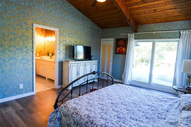 a bathroom with a double vanity sink mirror and toilet