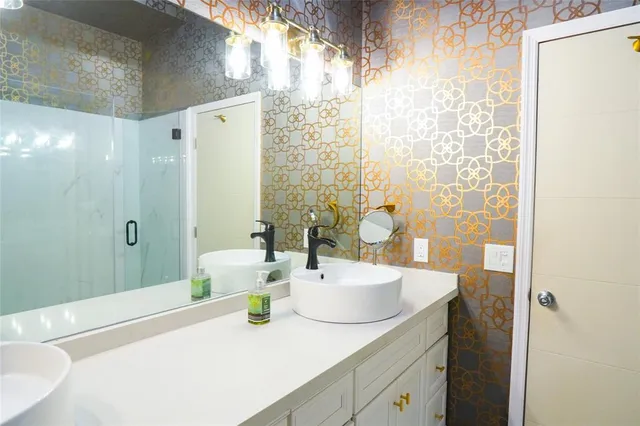 a view of a garage with a bike and a car