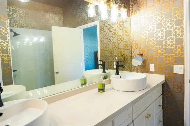 a view of a blue house with a yard