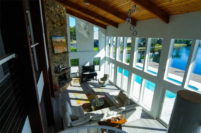 a living room with furniture and a piano