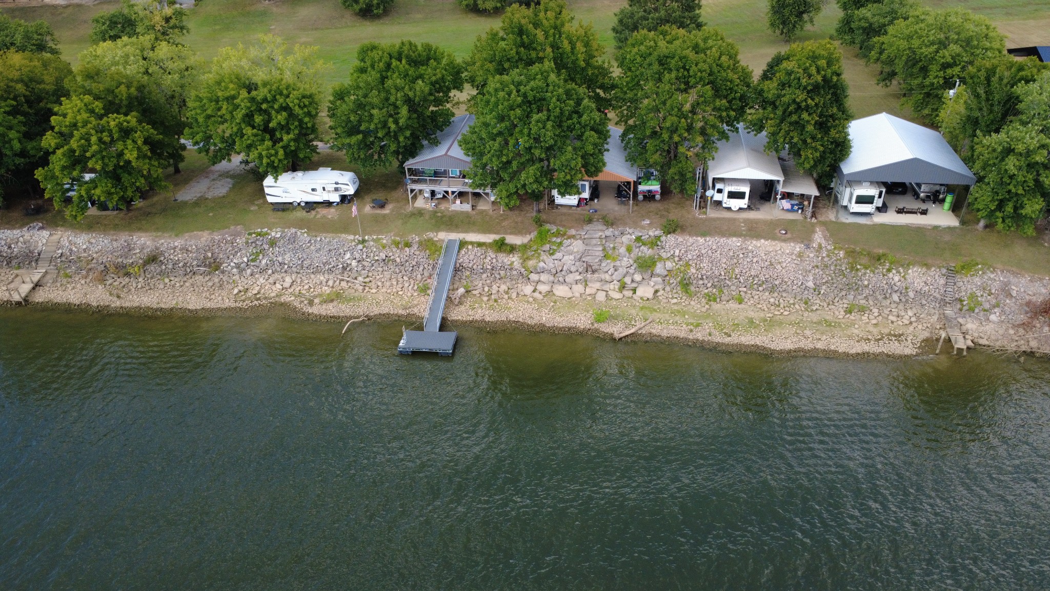 721 Beechview Road Clifton, TN 38425 - Photo 4 of 9 a view of a lake with a yard