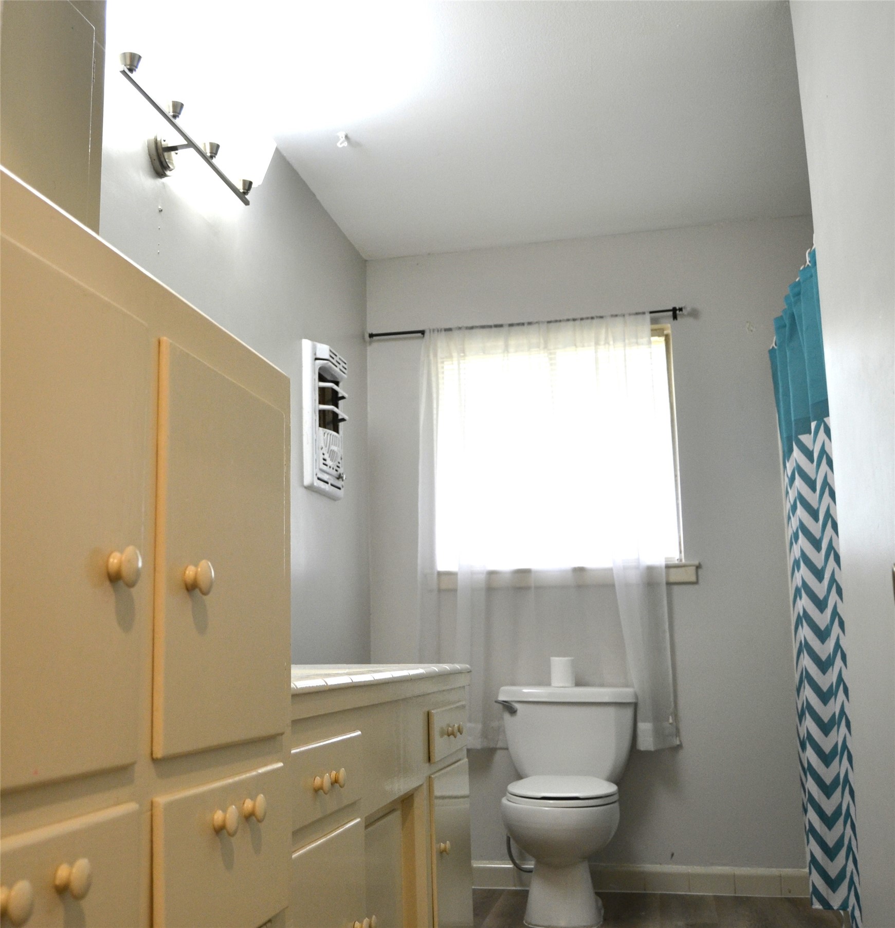 101 Summit Drive Conroe, TX 77303 - Photo 11 of 22 a bathroom with a toilet and a shower