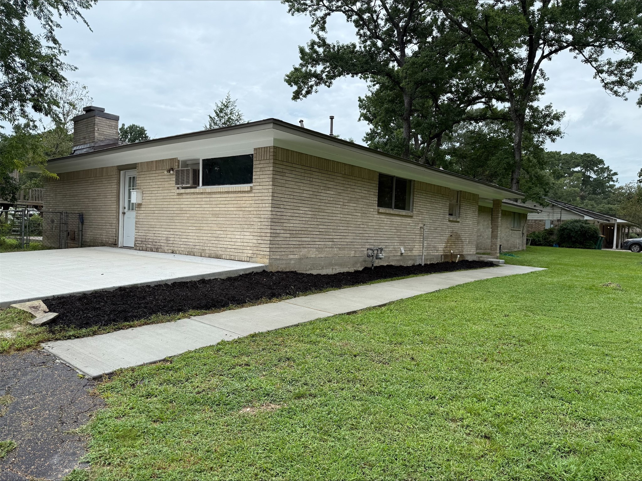 101 Summit Drive Conroe, TX 77303 - Photo 18 of 22 a front view of house with yard and trees