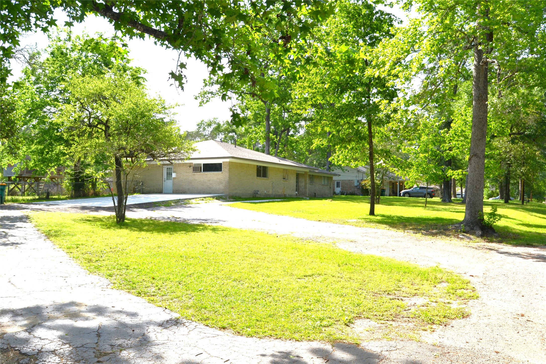101 Summit Drive Conroe, TX 77303 - Photo 3 of 22 a view of a swimming pool with an outdoor space