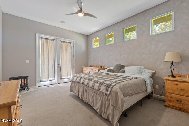 210 Nugget Avenue Dayton, NV 89403 - Photo 14 of 24 a bedroom with bed and a window