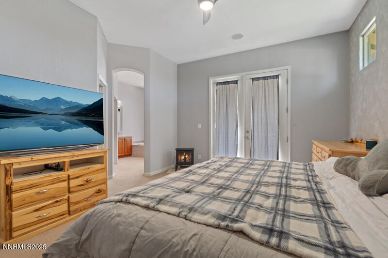 210 Nugget Avenue Dayton, NV 89403 - Photo 15 of 24 a bedroom with a bed and a window