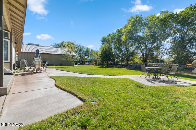 210 Nugget Avenue Dayton, NV 89403 - Photo 21 of 24 a view of a swimming pool with an outdoor space and seating area