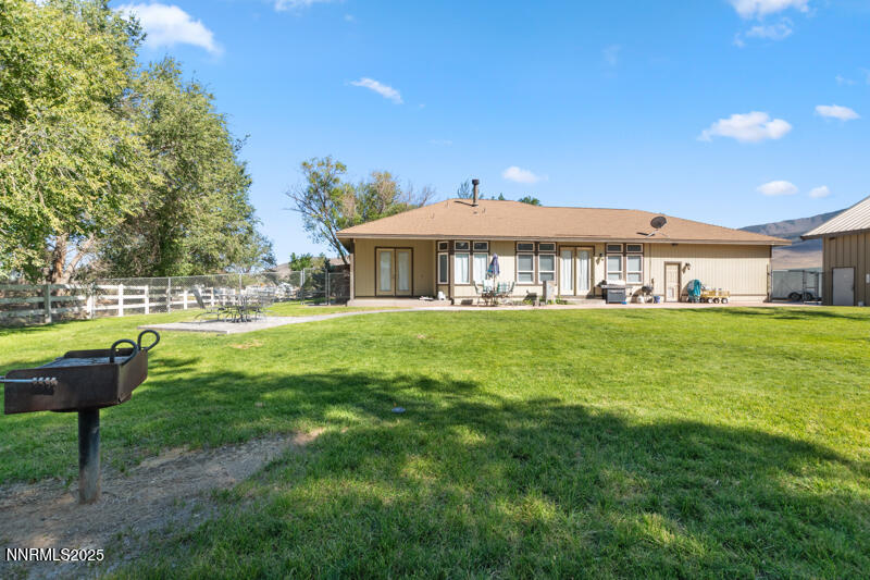 210 Nugget Avenue Dayton, NV 89403 - Photo 24 of 24 a view of a house with a yard table and chairs