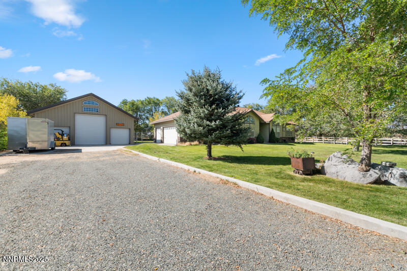 210 Nugget Avenue Dayton, NV 89403 - Photo 3 of 24 a view of a house with backyard and trees