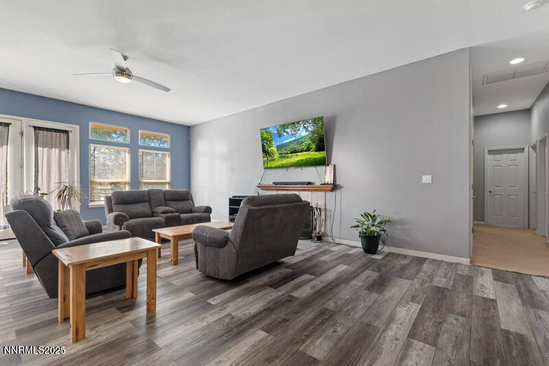 210 Nugget Avenue Dayton, NV 89403 - Photo 6 of 24 a living room with furniture and a flat screen tv