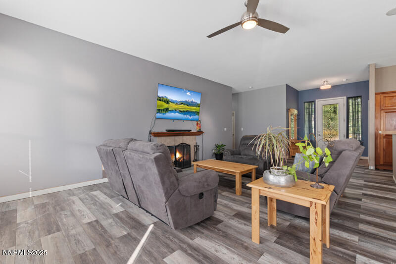 210 Nugget Avenue Dayton, NV 89403 - Photo 7 of 24 a living room with furniture and a flat screen tv