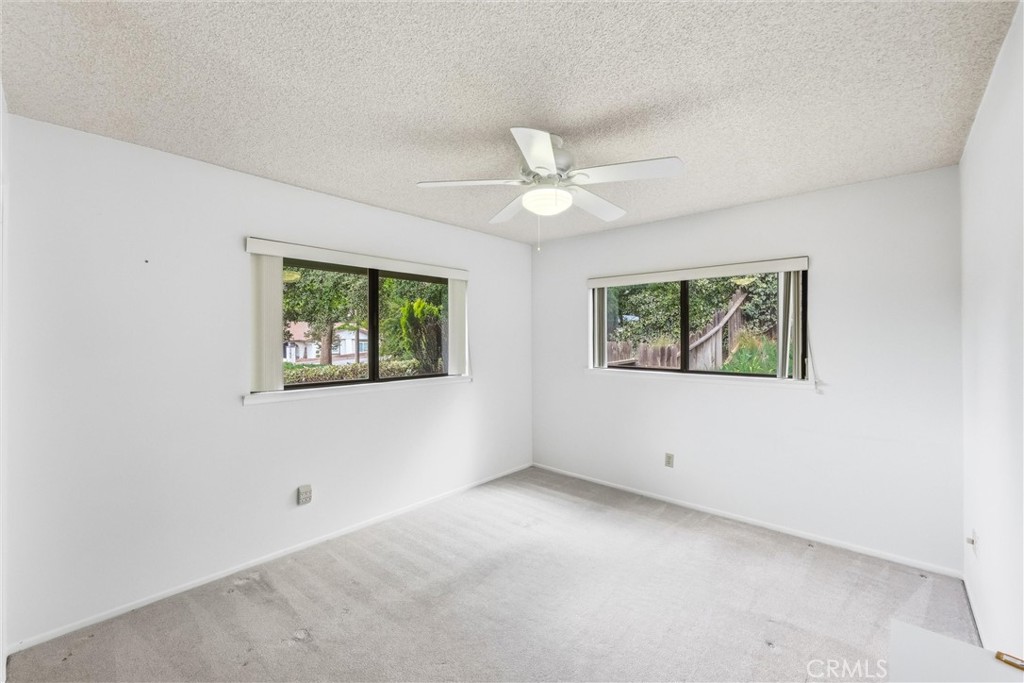 37295 Oak View Road Yucaipa, CA 92399 - Photo 37 of 59 an empty room with windows and fan