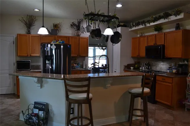 a front view of a house with a garden and yard