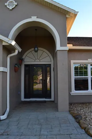 a view of an empty room and a window