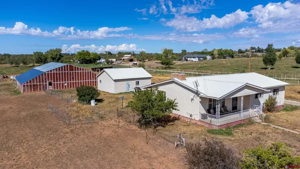an aerial view of a house with a garden
