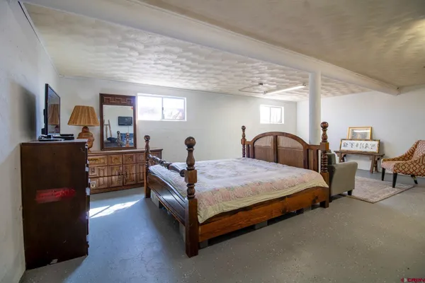 a view of a table and chairs in the middle of a yard