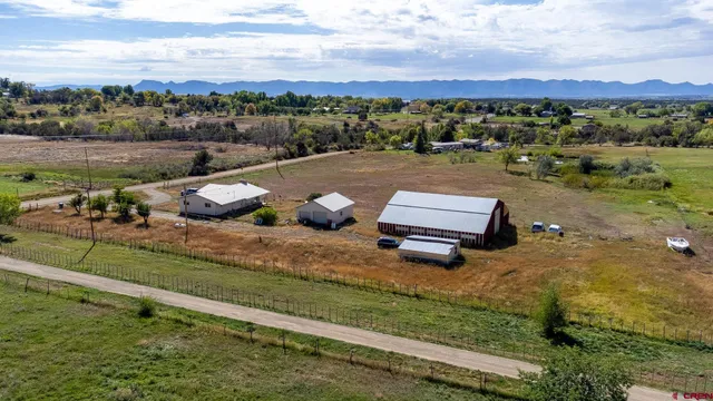 an aerial view of a garden with an outdoor seating