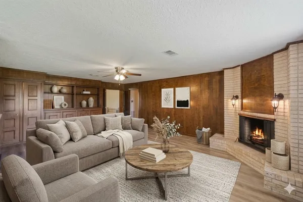 a living room with furniture and a fireplace