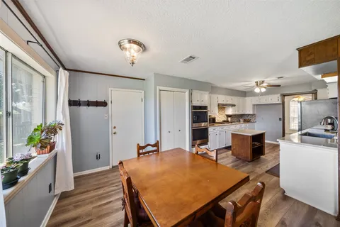 a very nice looking dining room with a table and chairs