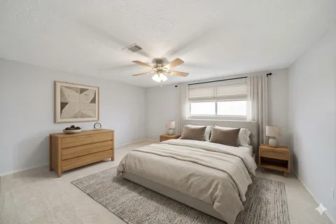 a bedroom with a bed and window