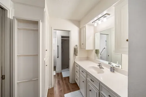 a bathroom with a double vanity sink mirror and double