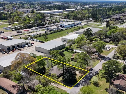 an aerial view of residential houses and outdoor space