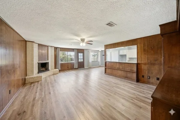a view of a livingroom with furniture and wooden floor