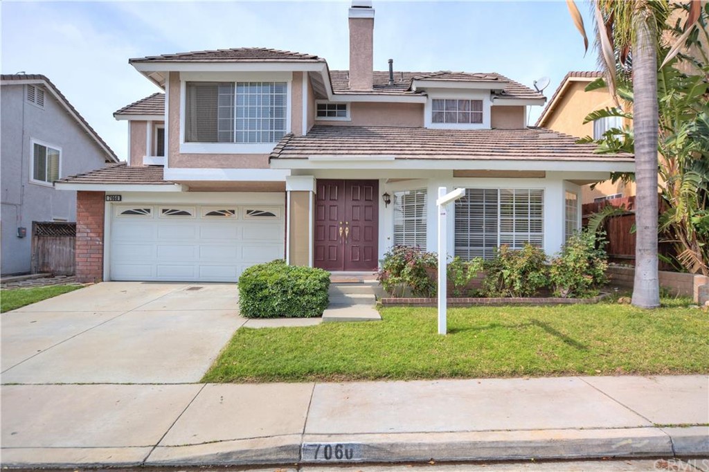 7060 Pizzoli Place Rancho Cucamonga, CA 91701 - Photo 1 of 1 a front view of a house with a yard and garage