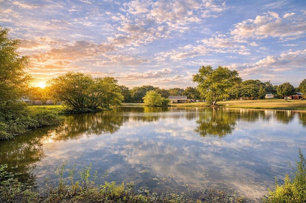 381 Cheyenne Quitman, TX 75783 - Photo 4 of 18 a view of a lake with houses in the background