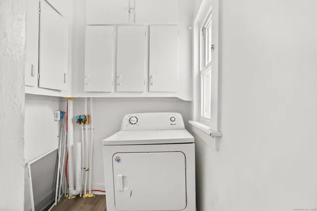 a utility room with dryer and washer