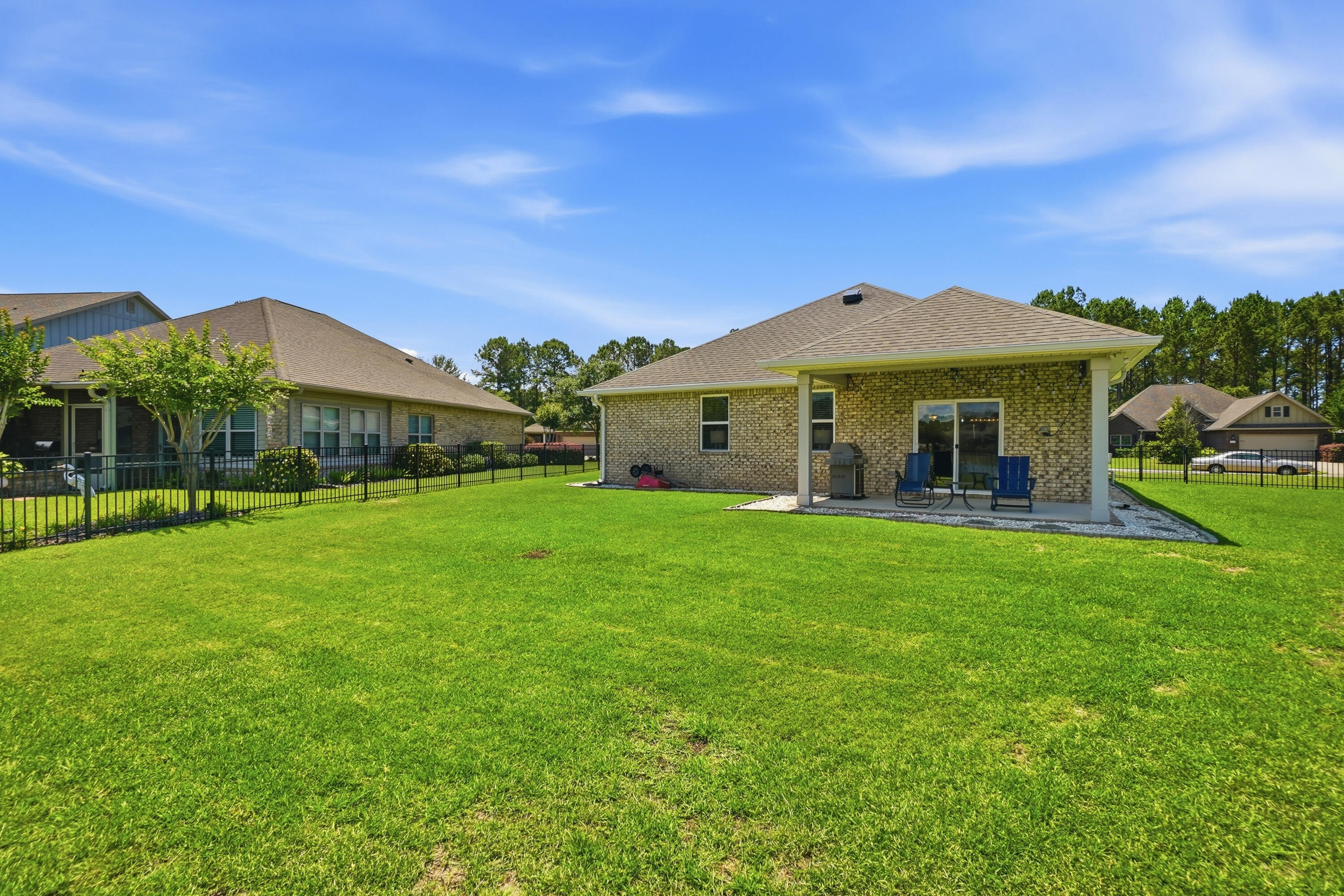 525 Windchime Way Freeport, FL 32439 - Photo 36 of 59 a view of a house with a big yard