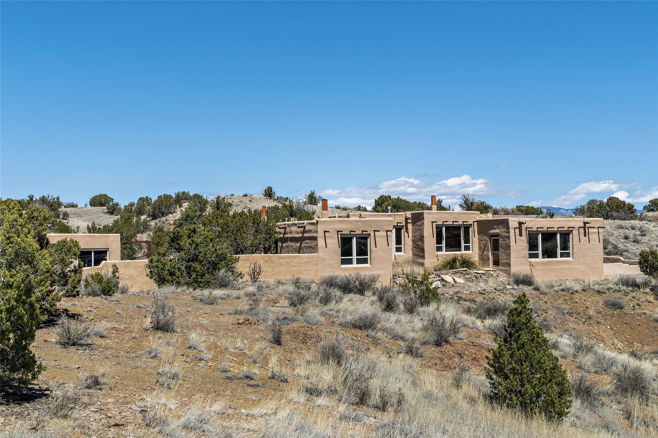 Artist haven passive solar Adobe home with walled courtyard and a studio