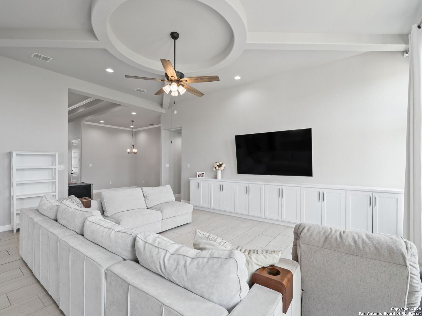 132 West Medium Meadow Drive Lytle, TX 78052 - Photo 12 of 46 a living room with furniture and a flat screen tv