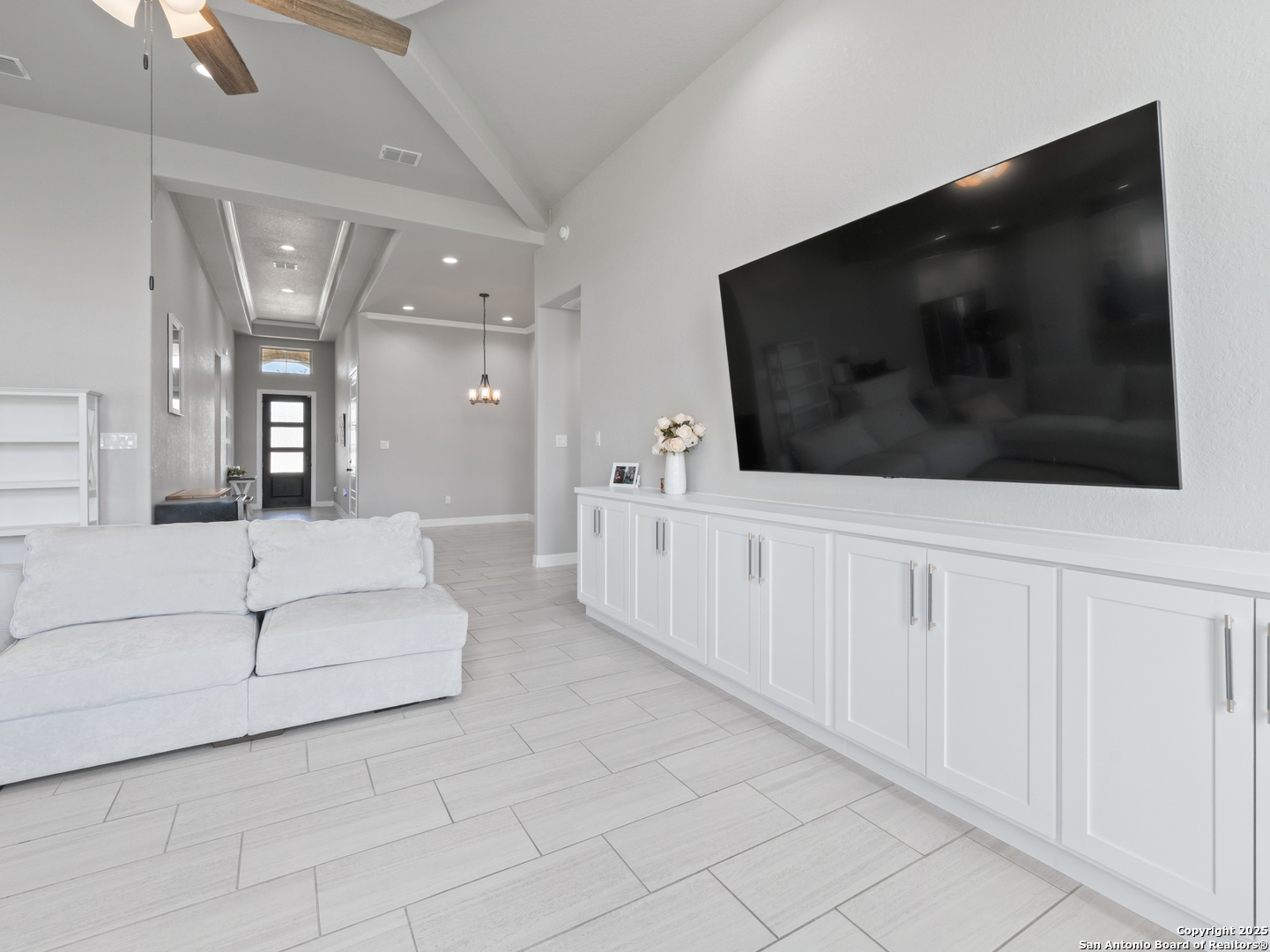 132 West Medium Meadow Drive Lytle, TX 78052 - Photo 13 of 46 a living room with furniture and a flat screen tv