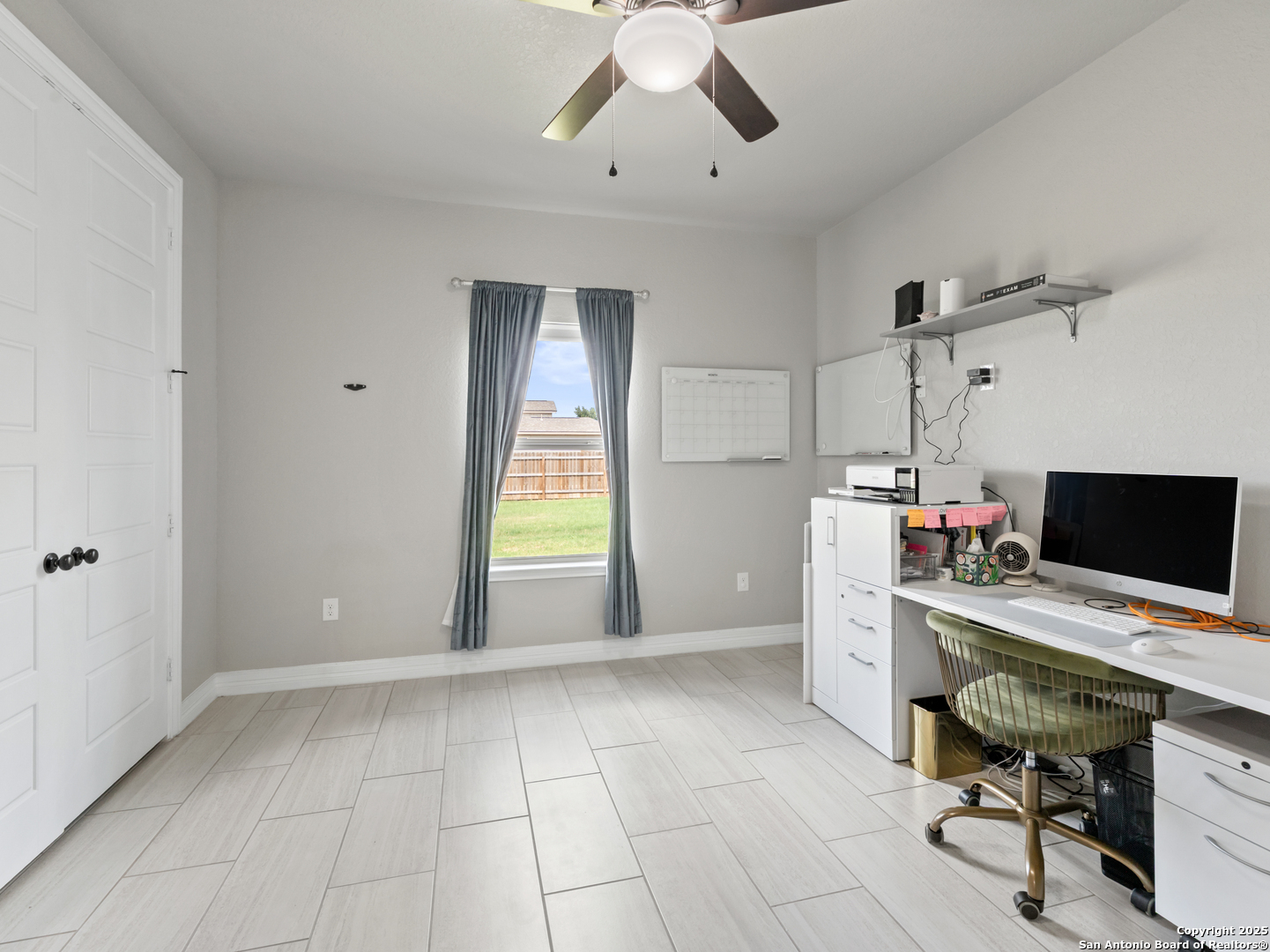 132 West Medium Meadow Drive Lytle, TX 78052 - Photo 18 of 46 a view of a workspace with furniture and a window