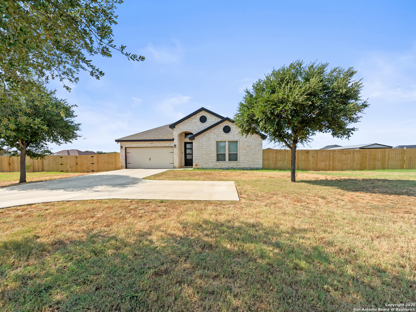 132 West Medium Meadow Drive Lytle, TX 78052 - Photo 2 of 46 a house with trees in the background