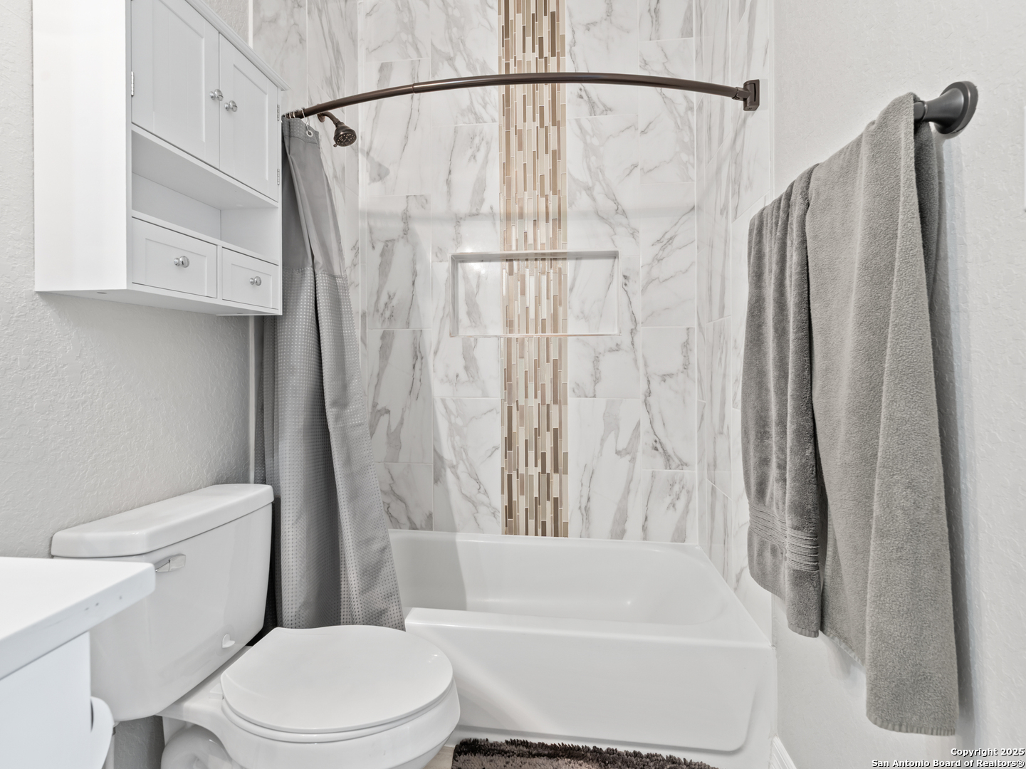 132 West Medium Meadow Drive Lytle, TX 78052 - Photo 24 of 46 a white toilet sitting next to a bath tub