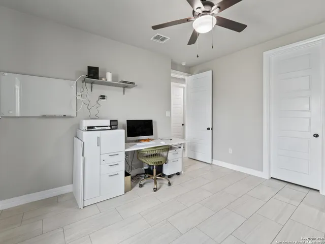 a workspace with furniture and window