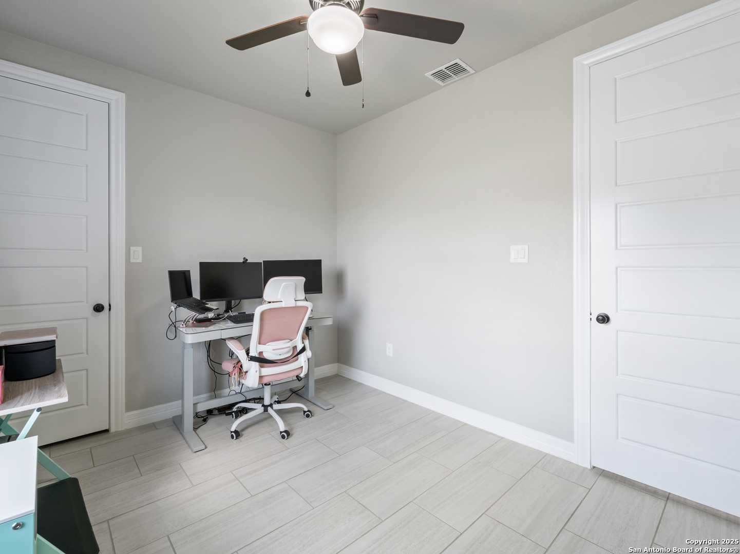 132 West Medium Meadow Drive Lytle, TX 78052 - Photo 28 of 46 a view of a workspace with furniture and a ceiling fan