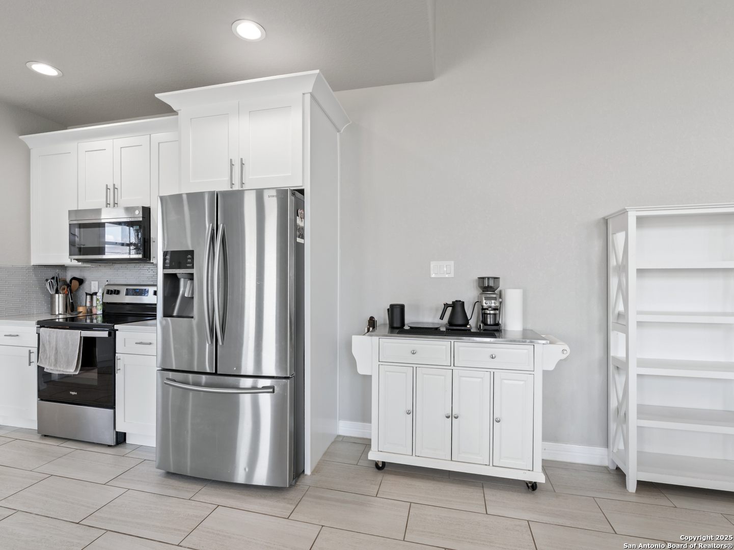 132 West Medium Meadow Drive Lytle, TX 78052 - Photo 36 of 46 a kitchen with stainless steel appliances a refrigerator sink and cabinets
