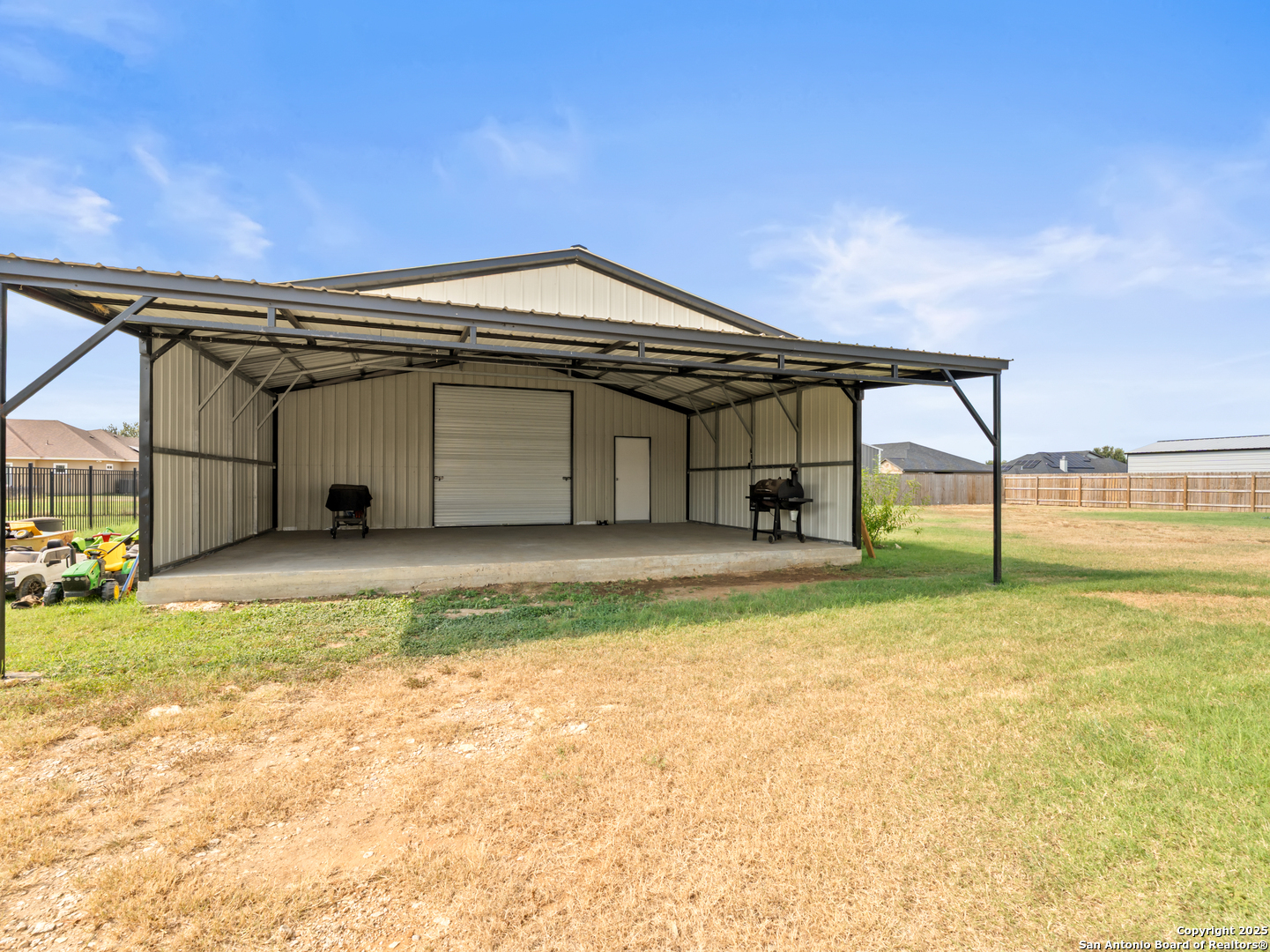 132 West Medium Meadow Drive Lytle, TX 78052 - Photo 39 of 46 a view of a house with backyard and porch