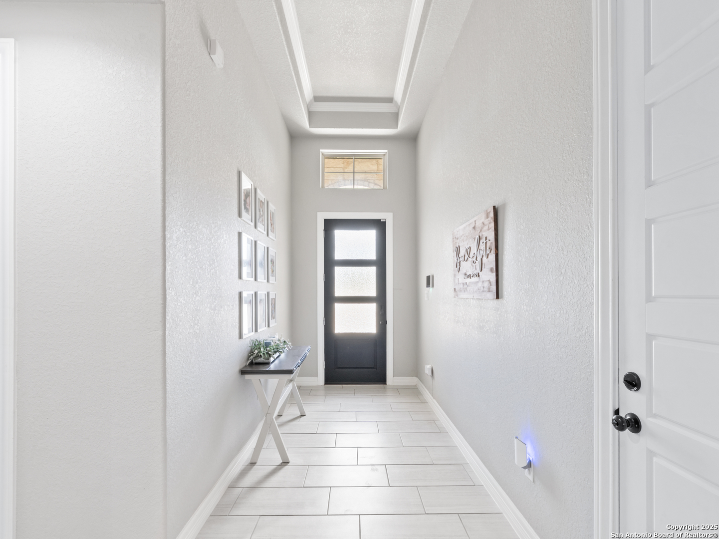 132 West Medium Meadow Drive Lytle, TX 78052 - Photo 5 of 46 a view of a hallway with windows and closet