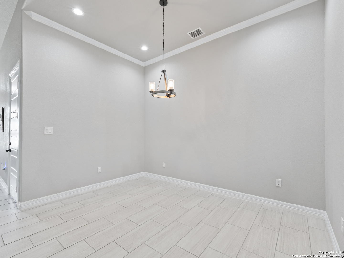 132 West Medium Meadow Drive Lytle, TX 78052 - Photo 8 of 46 a view of a room with window and hardwood floor