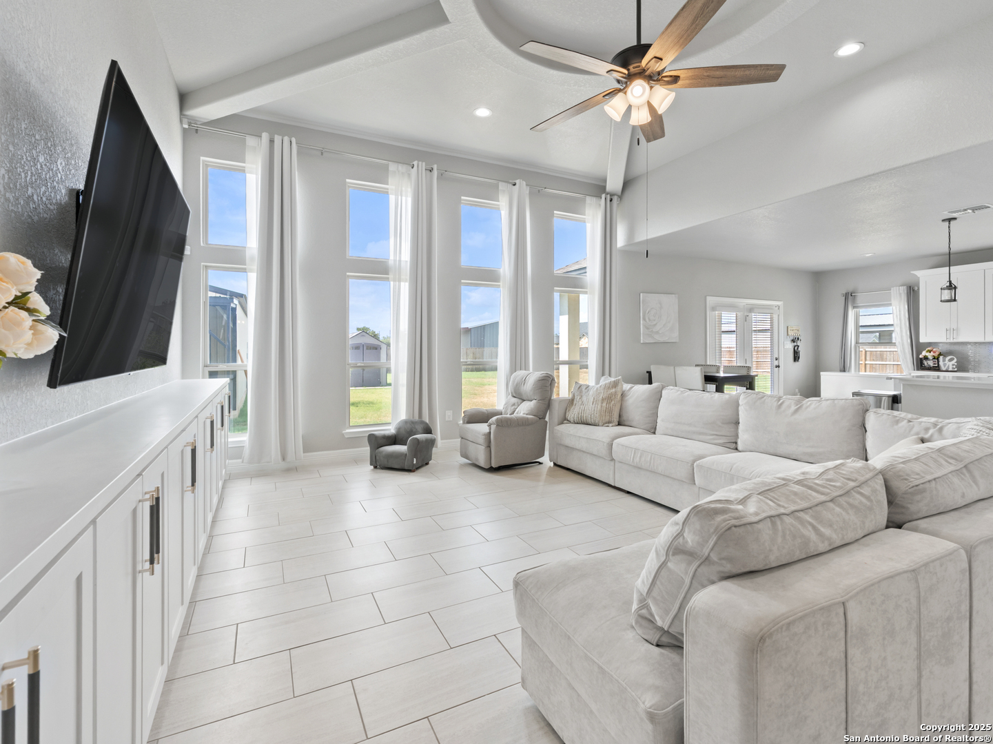 132 West Medium Meadow Drive Lytle, TX 78052 - Photo 9 of 46 a living room with furniture and a flat screen tv