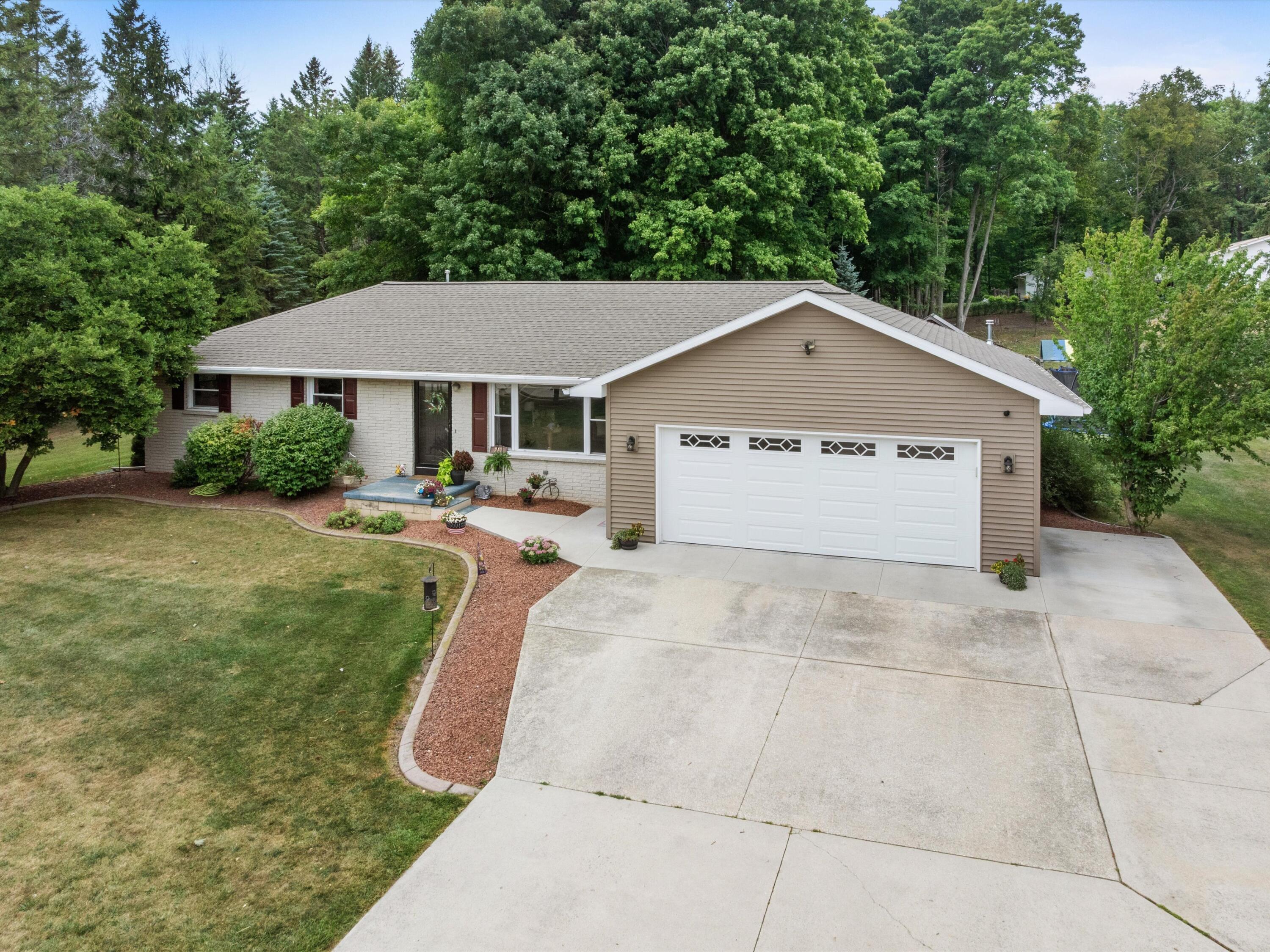 217 East Samz Road Mishicot, WI 54228 - Photo 2 of 43 02-Spacious driveway to 4 car attached g