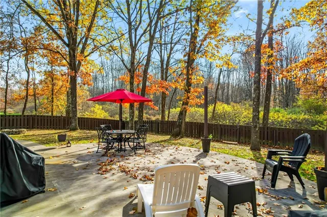 a view of a patio with a table chairs and a patio