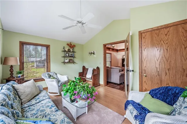 a kitchen with stainless steel appliances granite countertop sink stove and wooden floor